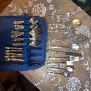 53 piece silver plated flatware set includes serving utensils and Haggerty case.
